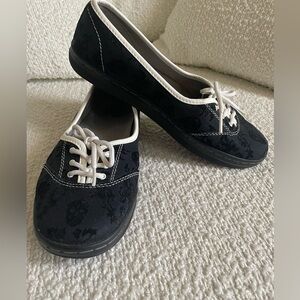 Dr. Martens skull slip ons